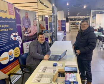 Lewis and John at the NETRALT stand in the Vaccination Hub, Bon Accord Centre, Aberdeen